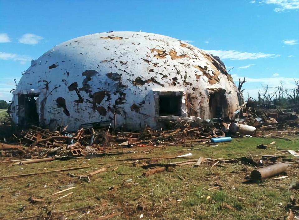 Battered dome home after surviving a direct hit by EF-4 tornado.