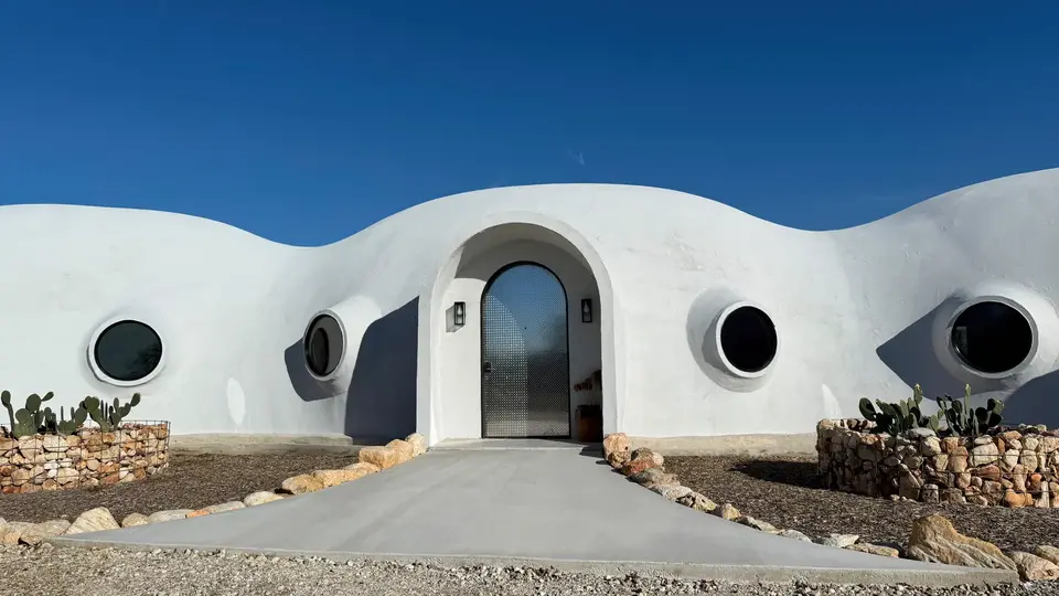 Exterior White Stucco Dome Home