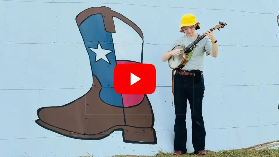 Phoebe Sanders Plays Her Banjo for Bruco, the Famous Texas-Italian Caterpillar
